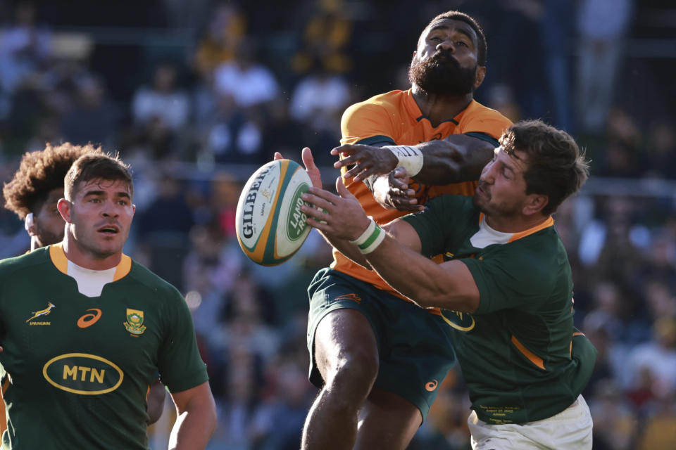 South Africa's Kwagga Smith, right, and Australia's Marika Koroibete compete for a ball during their Champions Rugby test match in Adelaide, Australia, on Saturday, Aug. 27, 2022. (AP Photo/James Elsby)