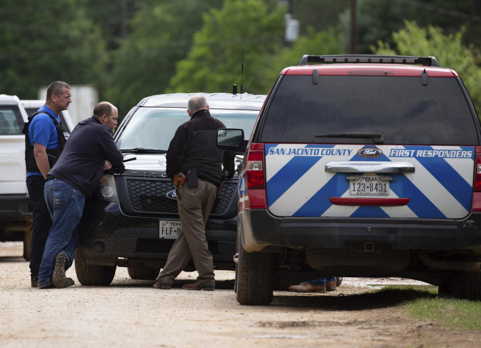 Law enforcement authorities responded to a scene where five people were shot the night before Saturday, April 29, 2023, in Cleveland, TX. Authorities say an 8-year-old child was among five people killed in a shooting at the home in southeast Texas late Friday night. (Yi-Chin Lee/Houston Chronicle via AP)