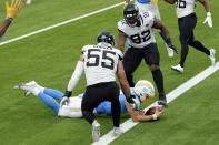 Los Angeles Chargers quarterback Justin Herbert, bottom, lunges into the end zone for a touchdown during the second half of an NFL football game against the Jacksonville Jaguars Sunday, Oct. 25, 2020, in Inglewood, Calif. (AP Photo/Kyusung Gong)