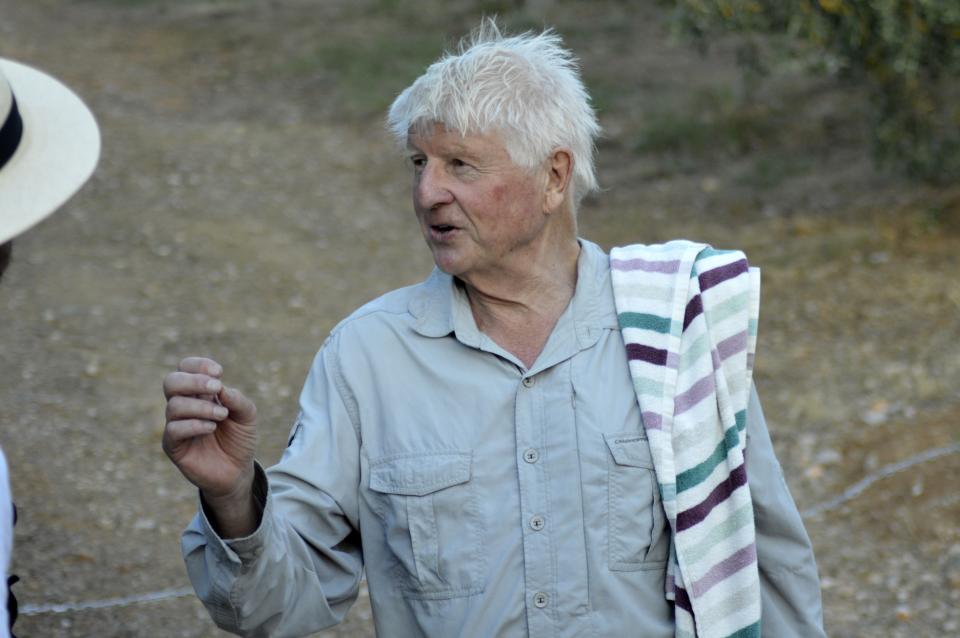 Stanley Johnson, father of Britain's Prime Minister Boris Johnson, speaks to a local reporter outside his Villa Irene in Horto village, Mount Pelion (also known as Pilio), central Greece, Friday, July 3, 2020. Johnson arrived in Athens on Wednesday evening after flying via Bulgaria due to a current ban on direct flights from the Britain, before visiting his villa on Mount Pelion. (Dimitris Kareklidis/magnesianews.gr via AP)