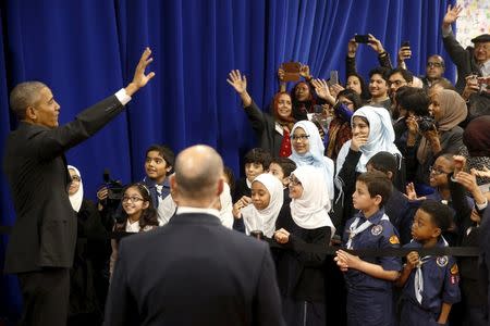 U.S. President Barack Obama waves farewell to students after his remarks at the Islamic Society of Baltimore mosque in Catonsville, Maryland February 3, 2016. REUTERS/Jonathan Ernst