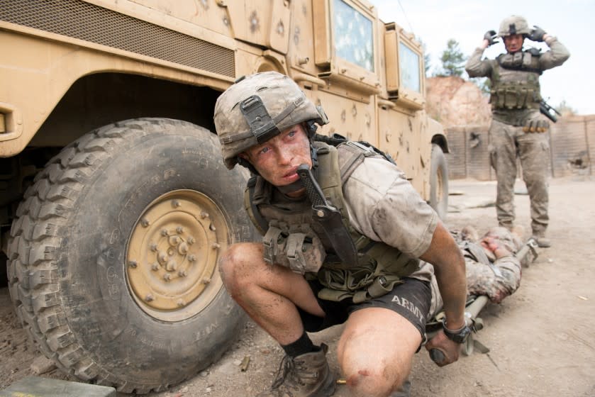 Caleb Landry Jones, left, in 'The Outpost'