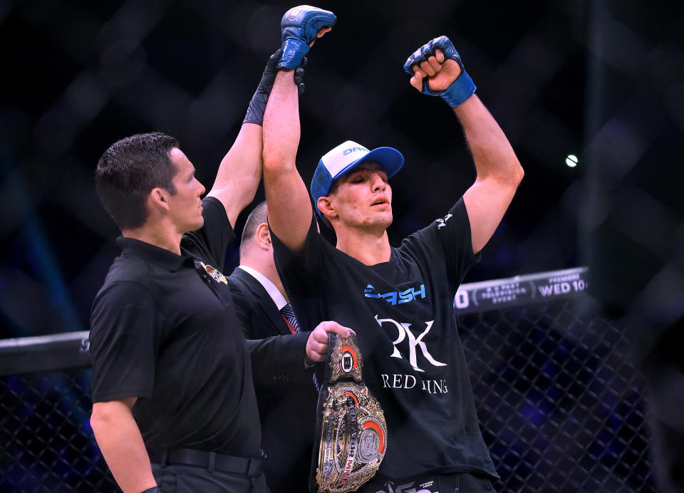 Referee Jason Herzog raises the hand of the new welterweight world champion Rory MacDonald after defeating Douglas Lima at Bellator 192 at The Forum on Jan. 20, 2018 in Inglewood, California. (Getty Images)