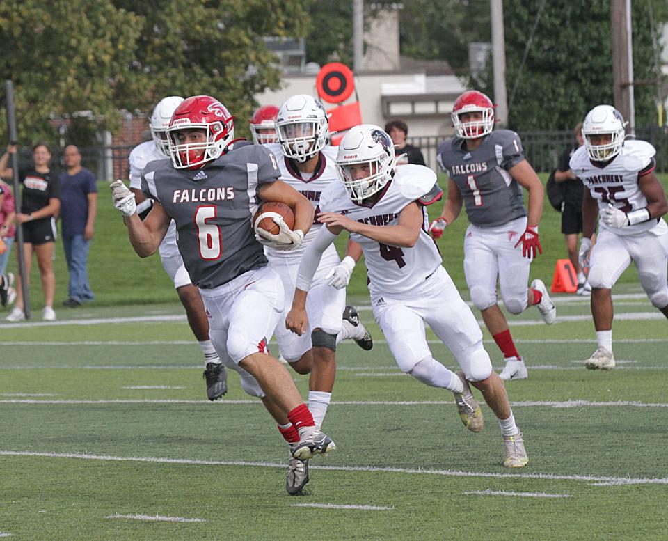 Dom Jacobs runs past everybody on his way for a 98-yard return for a touchdown on the opening kickoff Friday.