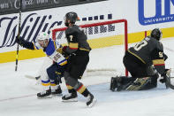 St. Louis Blues center Jordan Kyrou (25) celebrates after scoring against Vegas Golden Knights goaltender Robin Lehner (90) during the second period of an NHL hockey game Tuesday, Jan. 26, 2021, in Las Vegas. (AP Photo/John Locher)