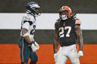 Cleveland Browns running back Kareem Hunt (27) celebrates after a 5-yard rushing touchdown during the second half of an NFL football game against the Philadelphia Eagles, Sunday, Nov. 22, 2020, in Cleveland. (AP Photo/Ron Schwane)