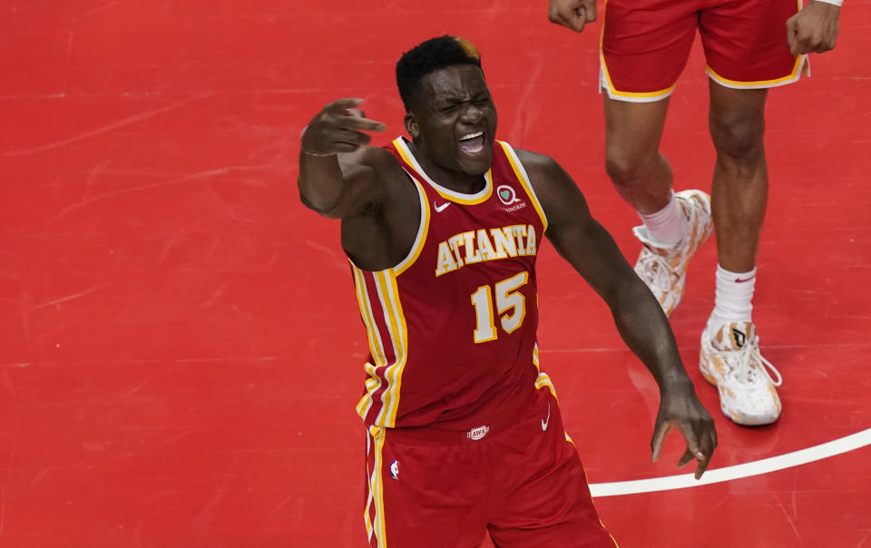 Atlanta Hawks center Clint Capela (15) reacts after a play against New York Knicks forward Julius Randle (30) during the second half in Game 3 of an NBA basketball first-round playoff series Friday, May 28, 2021, in Atlanta. (AP Photo/Brynn Anderson)