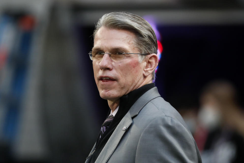 FILE - Minnesota Vikings general manager Rick Spielman, right, stands on the field before an NFL football game against the Chicago Bears, Jan. 9, 2022, in Minneapolis. Washington Commanders ownership is bringing in outside help to work on the search for the team's next coach and head of football operations. Controlling owner Josh Harris announced former NBA executive Bob Myers and Spielman will assist him, Magic Johnson, Mitch Rales and David Blitzer. The firing of Ron Rivera Monday, Jan. 8, 2024 came after Washington went 4-13 in charge as coach and decision maker on personnel matters. (AP Photo/Bruce Kluckhohn)