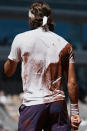 Stefanos Tsitsipas of Greece has his jersey dusted with clay after he fell while playing Serbia's Novak Djokovic during their final match of the French Open tennis tournament at the Roland Garros stadium Sunday, June 13, 2021 in Paris. (AP Photo/Thibault Camus)