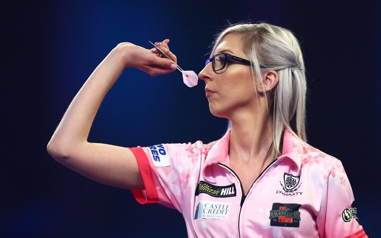 Fallon Sherrock of England throws during her third round match against Chris Dobey of England on Day 12 of the 2020 William Hill World Darts Championship at Alexandra Palace - GETTY IMAGES