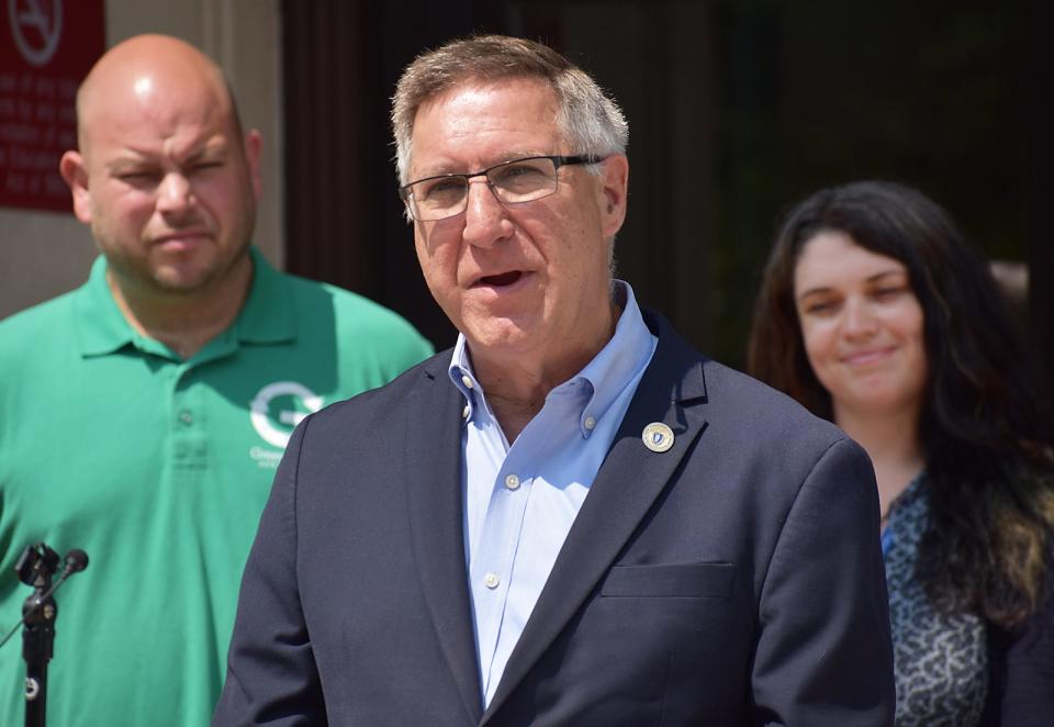 State Sen. Michael Rodrigues speaks at the announcement of the Westport recycling event. Behind him are Fred Cullen of Green Team Junk Removal and Taylor Bennett of National Grid.