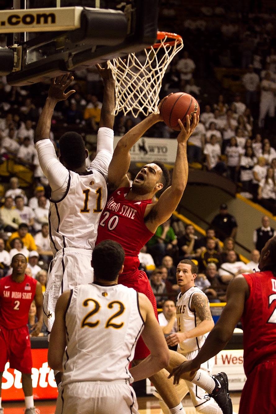 San Diego State's JJ O'Brien (20) drives to the hole against the University of Wyoming Cowboys in a NCAA college basketball game Tuesday, Feb. 11, 2014 at the Arena-Auditorium in Laramie, Wyo. (AP Photo/Jeremy Martin)