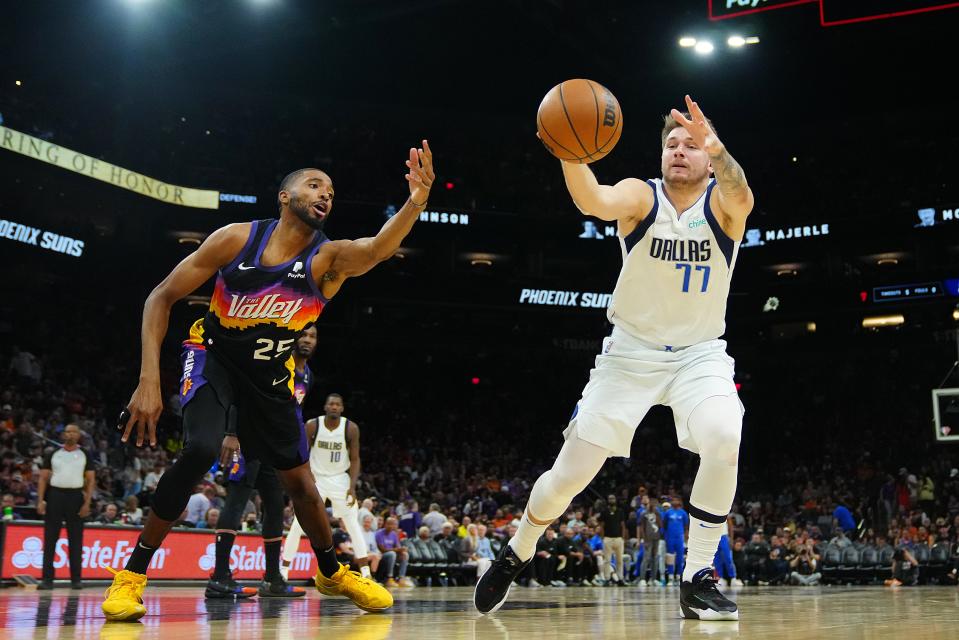 May 10, 2022; Phoenix, Arizona; USA; Suns Mikal Bridges (25) knocks the ball away from Mavericks Luka Doncic (77) during game 5 of the second round of the Western Conference Playoffs.