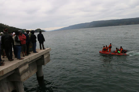 A search and rescue team heads out to look for passengers from the KM Sinar Bangun ferry which sank yesterday in Lake Toba, Simalungun, North Sumatra, Indonesia June 19, 2018 in this photo taken by Antara Foto. Antara Foto/Irsan Mulyadi/ via REUTERS