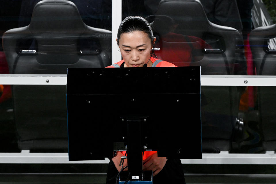 Referee Yoshimi Yamashita of Japan checks the VAR for a possible penalty during the Australia and New Zealand 2023 Women's World Cup Group A football match between New Zealand and Norway at Eden Park in Auckland on July 20, 2023. (Photo by Saeed KHAN / AFP) (Photo by SAEED KHAN/AFP via Getty Images)