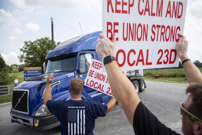 FILE - In this Sept. 13, 2021 file photo, members of Local 23D Union picket in front of Heaven Hill Distillery in Bardstown, Ky. Workers at one of the world’s largest bourbon producers, are scheduled to vote on a new contract on Saturday, Oct. 23, six weeks after walking out. The company announced a tentative contract agreement with the union representing striking workers on Friday(Silas Walker/Lexington Herald-Leader via AP, File)