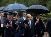 Olympics - Lighting Ceremony of the Olympic Flame Pyeongchang 2018 - Ancient Olympia, Olympia, Greece - October 24, 2017 The President of Greece Prokopis Pavlopoulos and the President of the International Olympic Committee Thomas Bach during the Olympic flame lighting ceremony for the Pyeongchang 2018 Winter Olympics REUTERS/Alkis Konstantinidis