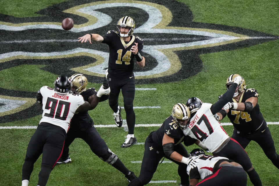 New Orleans Saints quarterback Andy Dalton (14) throws against the Atlanta Falcons in the second half of an NFL football game in New Orleans, Sunday, Dec. 18, 2022. (AP Photo/Gerald Herbert)