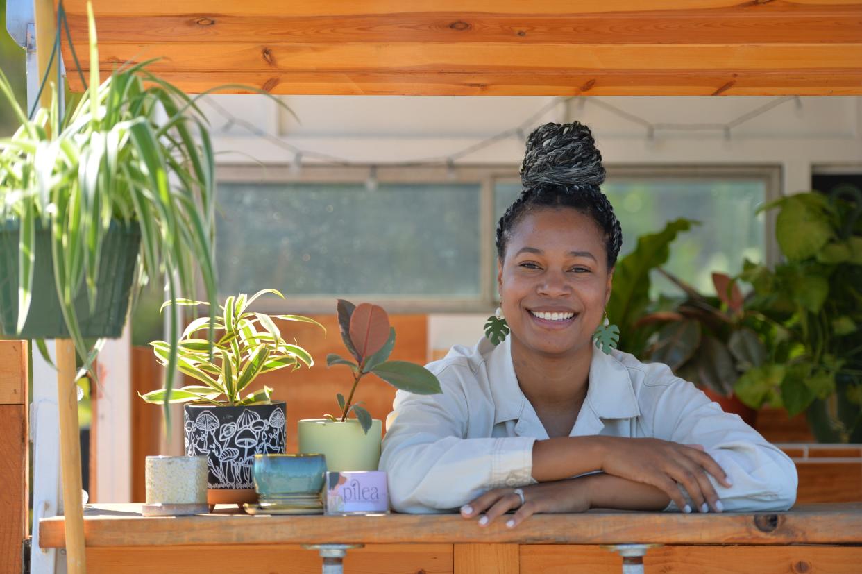 Taylor Robinson owns and operates Pilea Plants & Things, a mobile plant shop.  She uses a converted horse trailer to hold pop-up events for plant lovers. 