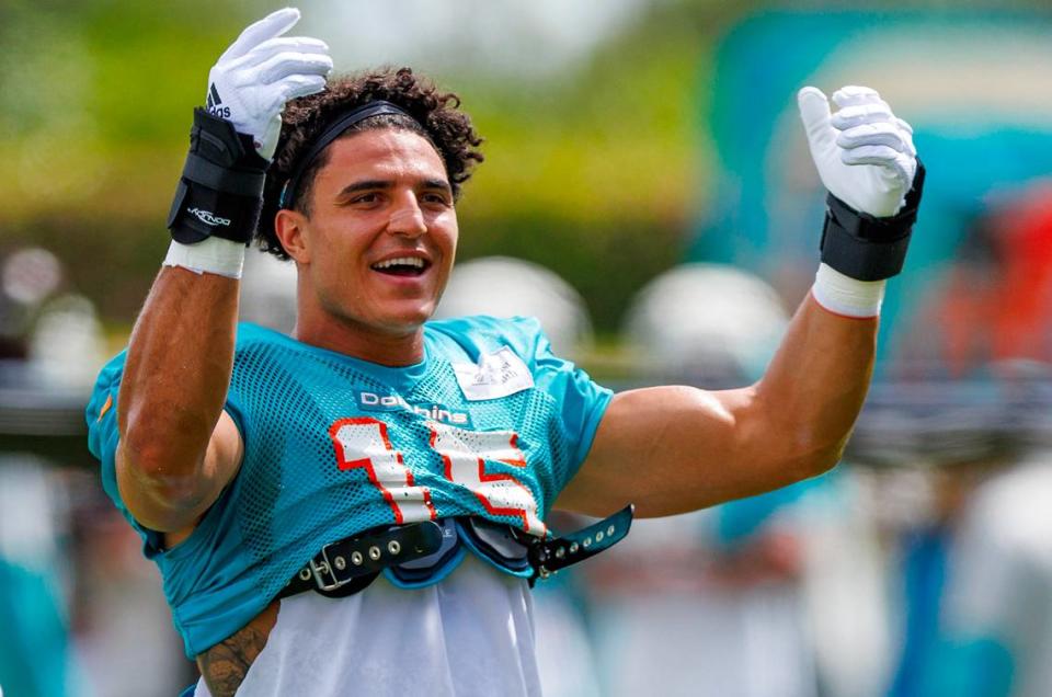 Miami Dolphins linebacker Jaelan Phillips (15) greets the fans during NFL football training camp at Baptist Health Training Complex in Hard Rock Stadium on Tuesday, August 1, 2023 in Miami Gardens, Florida.