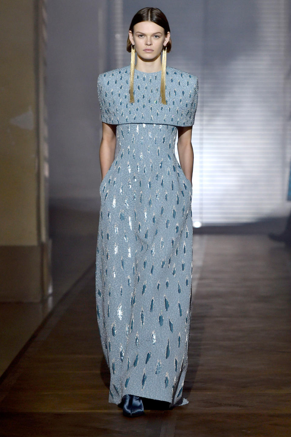 <p>Model wears a blue- and silver-embellished gown with long gold tassel earrings from the Givenchy SS18 Haute Couture show. (Photo: Getty Images) </p>