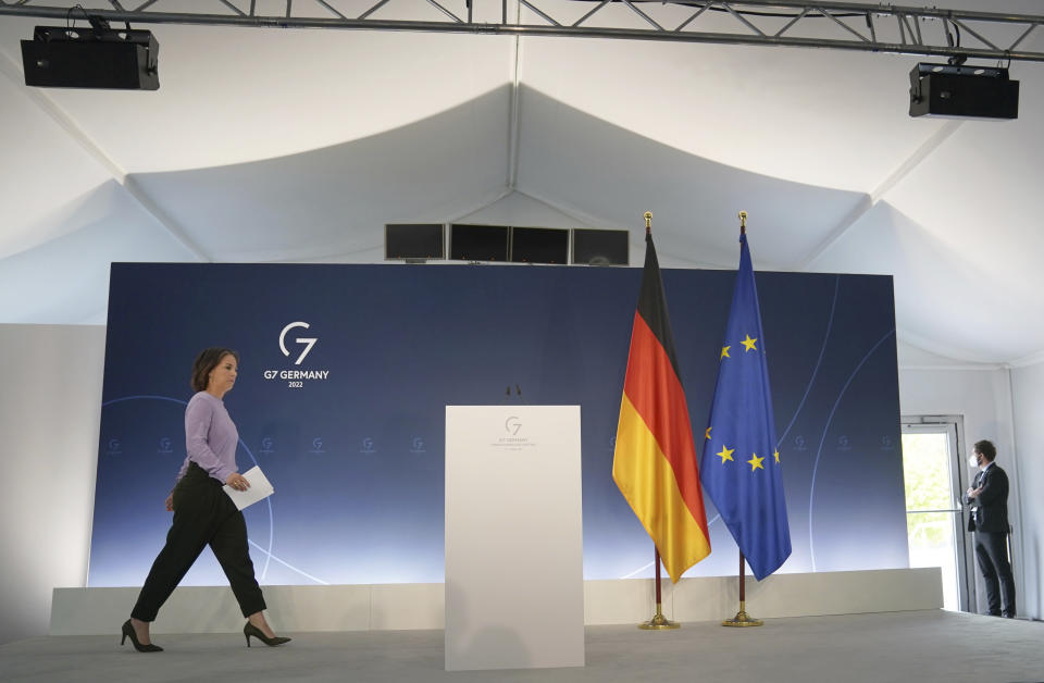 Annalena Baerbock, Foreign Minister of Germany, walks to the closing press conference of the summit of foreign ministers of the G7 group of leading democratic economic powersin Weissenhaeuser Strand, Germany, Sarurday, May 14, 2022. The meeting under German presidency was chaired by Foreign Minister Baerbock. In addition to the United States and Germany, the G7 also includes Great Britain, France, Italy, Canada and Japan. (Marcus Brandt/dpa via AP)