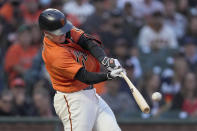 San Francisco Giants' Buster Posey hits an RBI double against the Houston Astros during the third inning of a baseball game Friday, July 30, 2021, in San Francisco. (AP Photo/Tony Avelar)