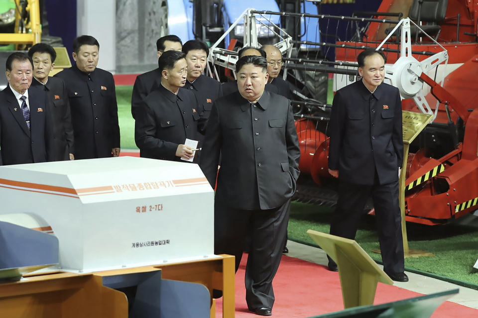In this photo provided by the North Korean government, North Korean leader Kim Jong Un, center, inspects an agricultural machinery exhibition in Pyongyang, North Korea, Tuesday, Jan. 2, 2024. Independent journalists were not given access to cover the event depicted in this image distributed by the North Korean government. The content of this image is as provided and cannot be independently verified.(Korean Central News Agency/Korea News Service via AP)