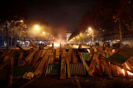 A barricade is seen during a "Yellow vest" protest against higher fuel prices, on the Champs-Elysees in Paris, France, November 24, 2018. REUTERS/Benoit Tessier