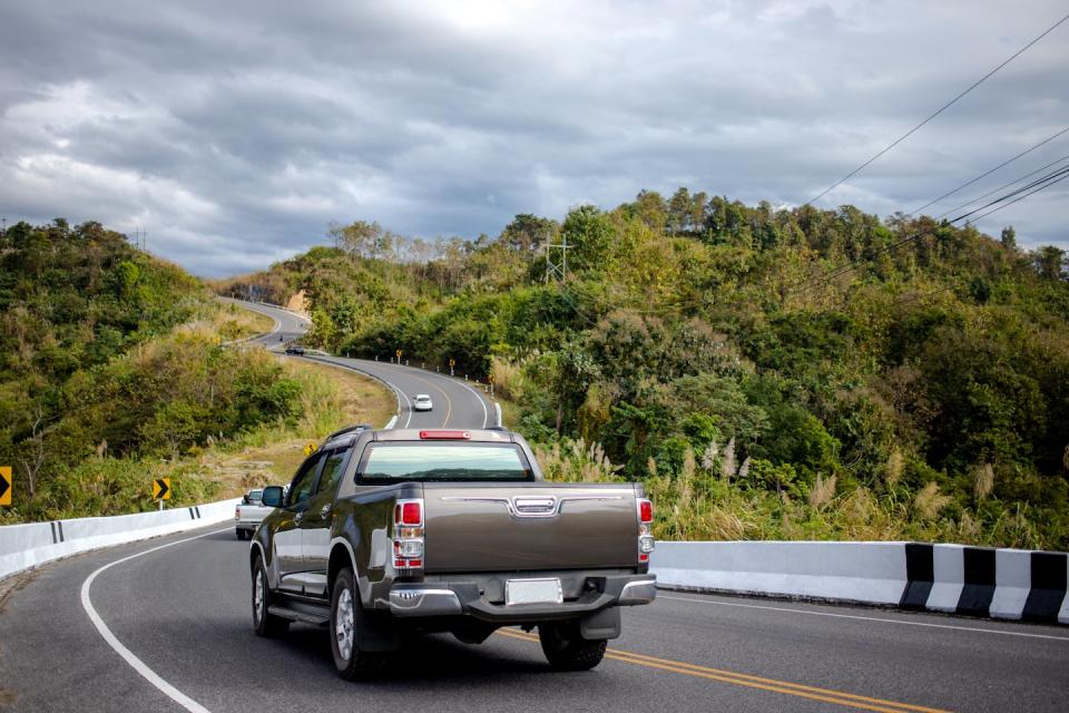 Ute drives on a country road