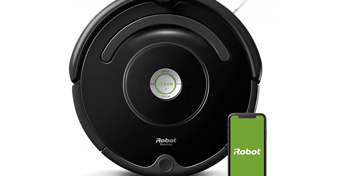 circular irobot roomba next to phone with green screen that says irobot