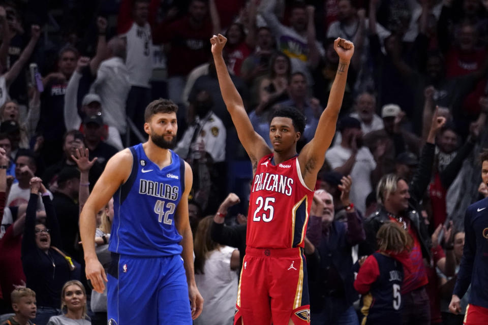 New Orleans Pelicans guard Trey Murphy III (25) celebrates at the final buzzer as Dallas Mavericks forward Maxi Kleber (42) walks toward the bench at the conclusion of an NBA basketball game in New Orleans, Tuesday, Oct. 25, 2022. The Pelicans won 113-111. (AP Photo/Gerald Herbert)