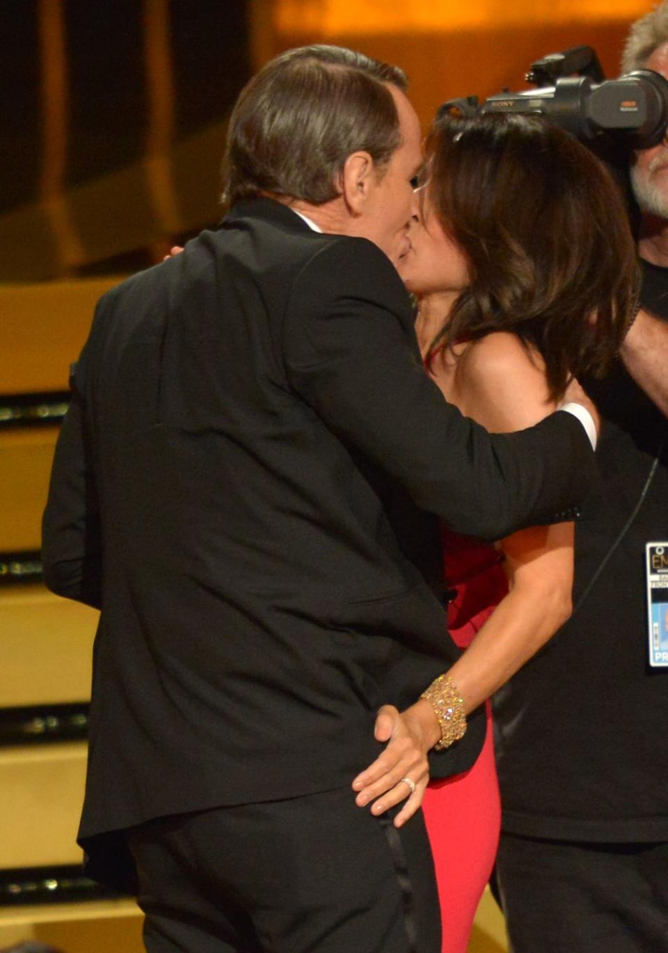 <p>Remember when Bryan Cranston appeared on <em>Seinfeld</em> as Julia Louis-Dreyfus' character's love interest? At the 2014 Emmys, they reminded everyone of that. As Louis-Dreyfus made her way to the stage to accept her award for Outstanding Lead Actress in a Comedy Series, Cranston grabbed her for a quick makeout session. <br></p>