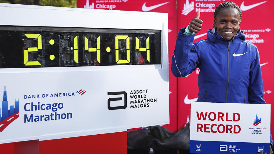 Brigid Kosgei, pictured here with her world record time.