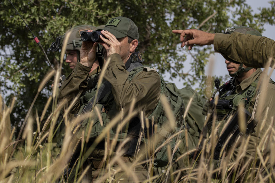 In this Wednesday, May 13, 2020 photo, Israeli troops take part in a drill in northern Israel. Twenty years after Hezbollah guerrillas pushed Israel’s last troops from southern Lebanon, both sides are gearing up for a war that neither seems to want. Israeli troops are drilling for a possible invasion of Lebanon and striking Hezbollah targets in neighboring Syria. Hezbollah is beefing up its own forces and threatening to invade Israel. (AP Photo/Tsafrir Abayov)