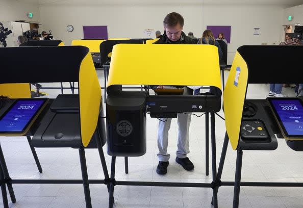 BURBANK, CA - MARCH 05: A voter casts their ballot on March 05, 2024 in Burbank, California. 15 States and one U.S. Territory hold their primary elections on Super Tuesday, awarding more delegates than any other day in the presidential nominating calendar.  (Photo by Justin Sullivan/Getty Images)