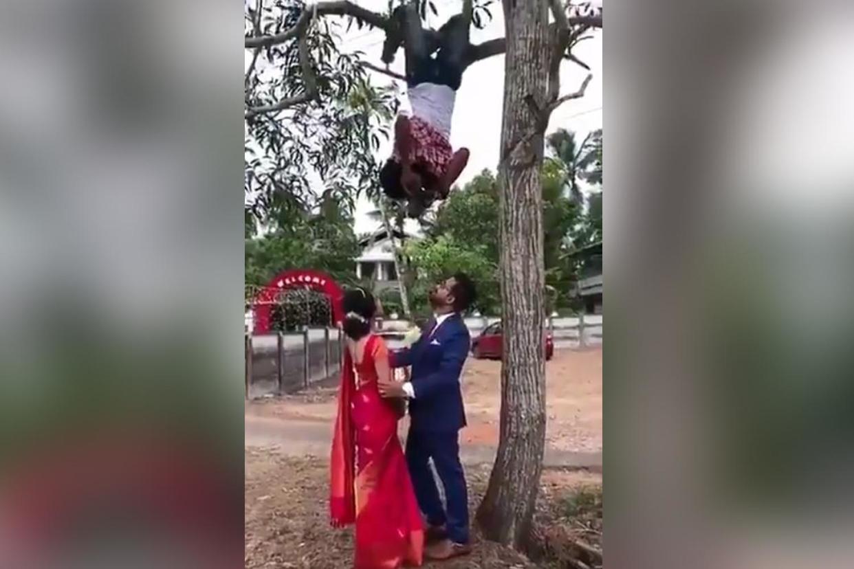 The photographer was nicknamed Spider-Man after climbing into a tree to take a photo of the happy couple: Twitter/ @HaramiParindey