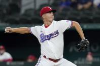 Texas Rangers starting pitcher Glenn Otto throws during the first inning of the team's baseball game against the Houston Astros in Arlington, Texas, Thursday, Sept. 16, 2021. (AP Photo/Tony Gutierrez)