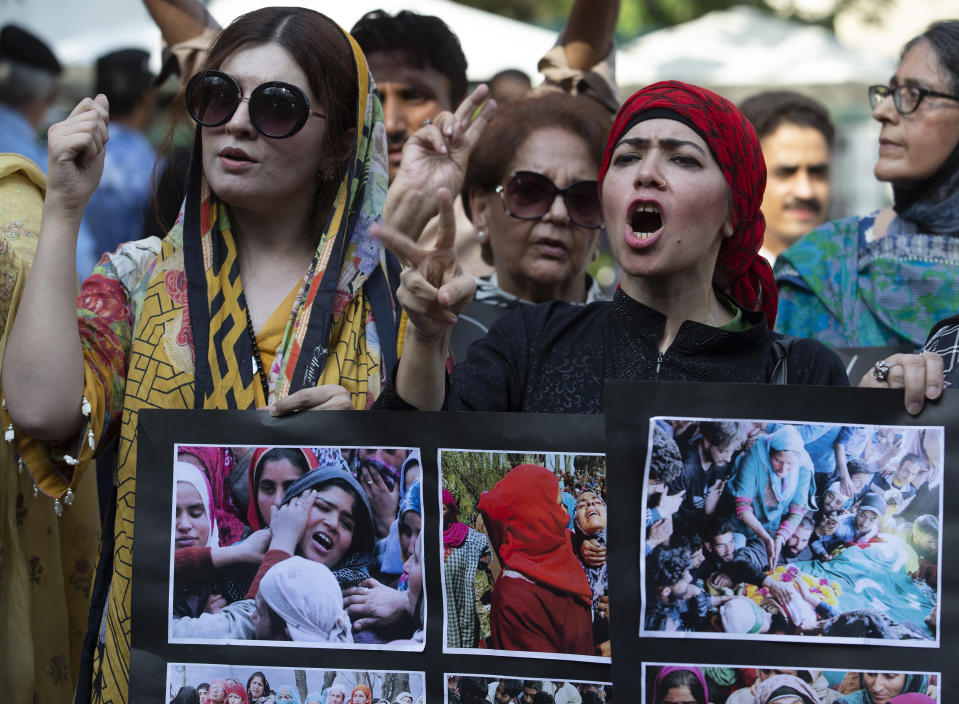 Mushaal Hussein Mullick, left, wife of Kashmiri rebel leader Yasin Malik shouts anti-Indian slogans with others during a protest to express solidarity with Indian Kashmiris, in Islamabad, Pakistan, Thursday, Aug. 29, 2019. (AP Photo/B.K. Bangash)