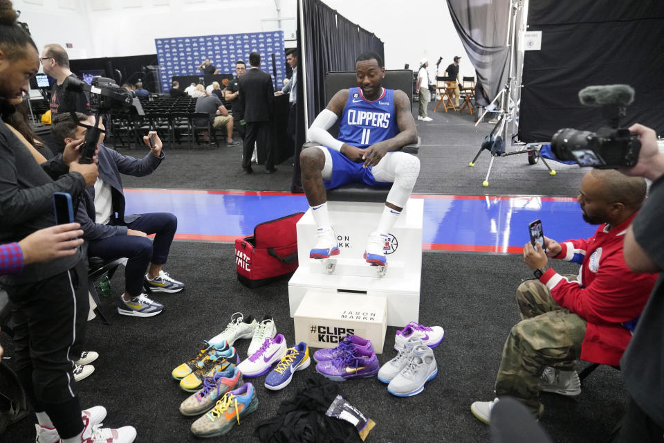 Los Angeles Clippers guard John Wall showcases his sneakers during the NBA basketball team's Media Day, Monday, Sept. 26, 2022, in Los Angeles (AP Photo/Marcio Jose Sanchez)