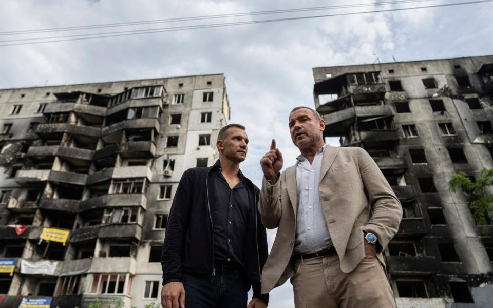 Former Chelsea FC striker Andriy Shevchenko, left, and Hollywood actor Liev Schreiber speak to media in Borodianka, near Kyiv -  Evgeniy Maloletka/AP 