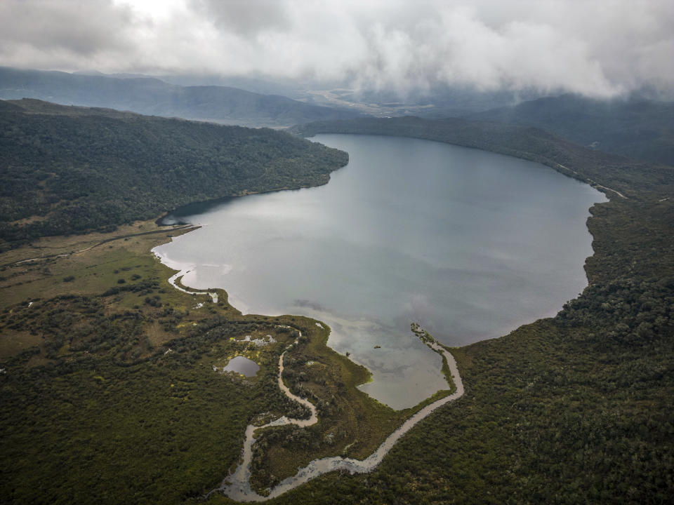 FILE - Clouds float over the Chingaza lagoon in the paramo of Chingaza National Natural Park, Colombia, Tuesday, March 19, 2024, the primary water source for millions of residents in the capital city of Bogota. Bogota's main source of water, the Chingaza Reservoir System, is currently 15% full. (AP Photo/Ivan Valencia, File)