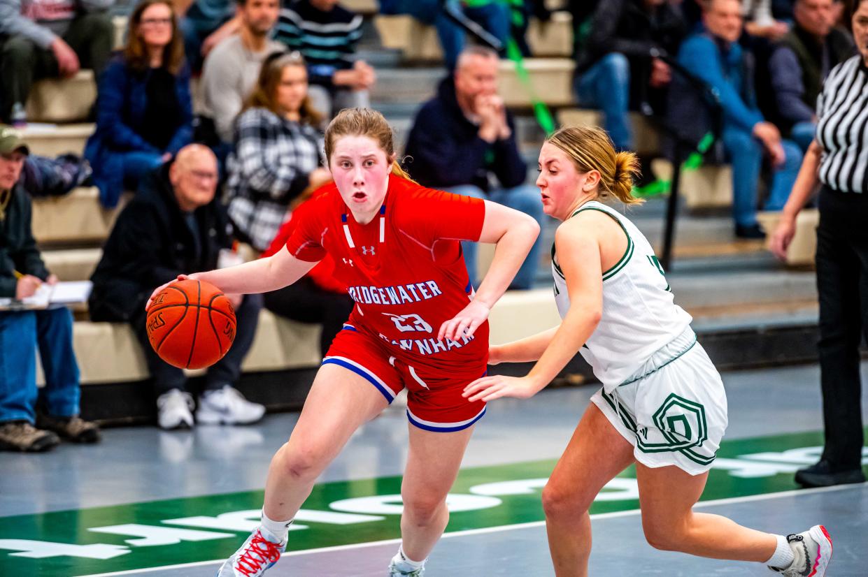 Bridgewater-Raynham's Reese Bartlett drives past Dartmouth's Lily Gangi.