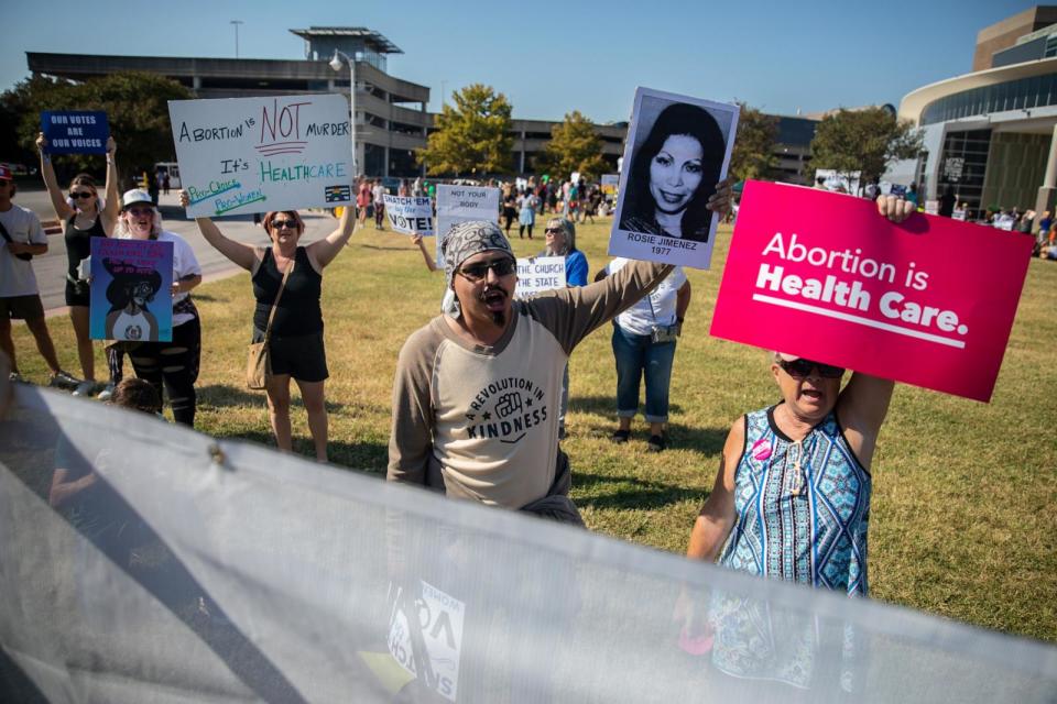 PHOTO: Abortion rights demonstrators chant and hold signs during a Women's March in Austin, Texas, Oct. 8, 2022. (Montinique Monroe/Bloomberg via Getty Images)