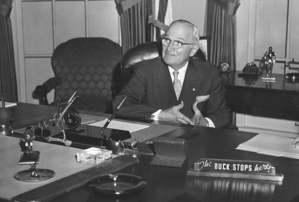 In July 1959, former President Harry S. Truman sat at the desk in a reproduction of his White House office at the Harry S. Truman Library & Museum in Independence, complete with “The Buck Stops Here” sign.