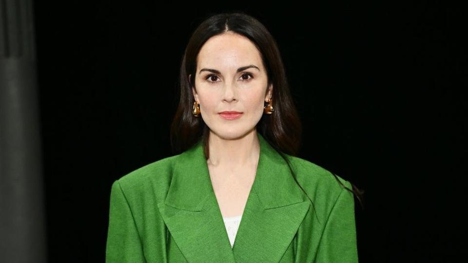 Michelle Dockery in a green suit 