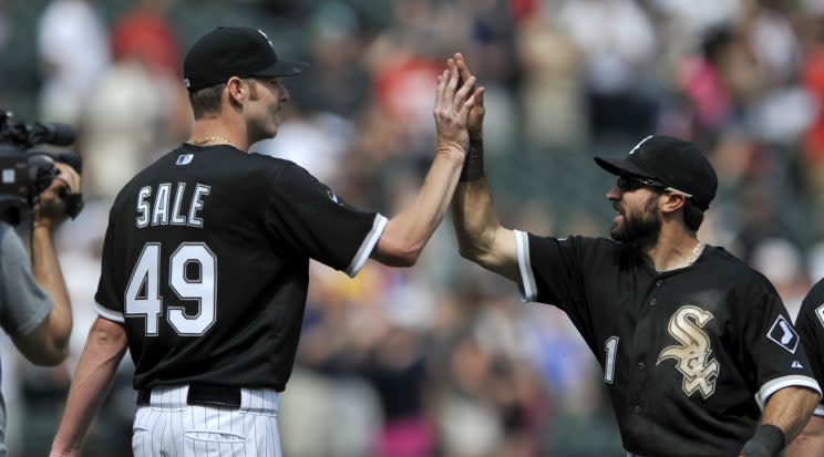 Chicago White Sox starting pitcher Chris Sale (49), celebrates with teammate Adam Eaton (1), after defeating the San Diego Padres 4-1 during an inter league baseball game in Chicago, Sunday, June 1, 2014. (AP Photo/Paul Beaty)