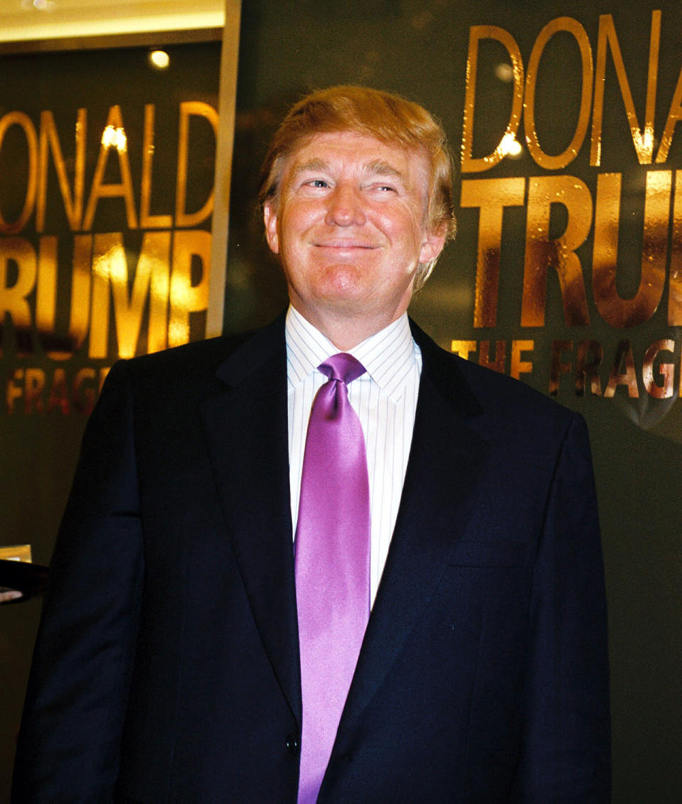 <p>Donald Trump makes a promotional appearance at Marshall Fields for his new cologne, the Fragrance, on Dec. 7, 2004, in Chicago. <i>(Photo: Scott Harrison/Getty Images)</i> </p>