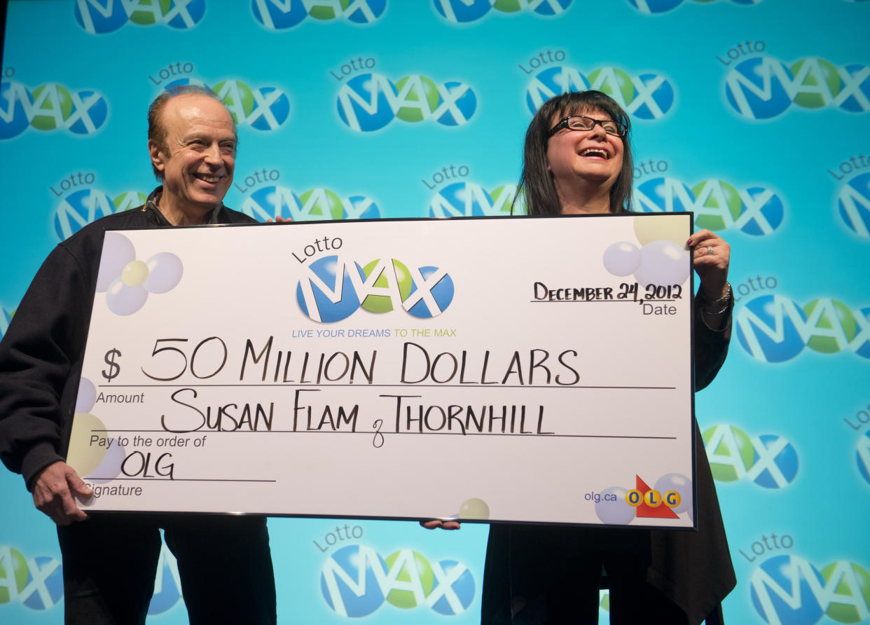 TORONTO, ON - DECEMBER 24: 24 December  2012. Cheque presentation and media opportunity with Susan Flam (with hubby Ron in some pix), winner of $50 million from the Friday, December 21, 2012 LOTTO MAX jackpot draw. Photos by Keith Beaty.        (Keith Beaty/Toronto Star via Getty Images)