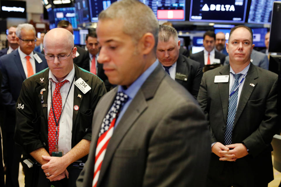 <p>Traders pause for a moment of silence marking the 17th anniversary of the September 11, 2001 attacks on the World Trade Center on the floor of the New York Stock Exchange shortly before the opening bell in New York, Sept. 11, 2018. (Photo: Lucas Jackson/Reuters) </p>